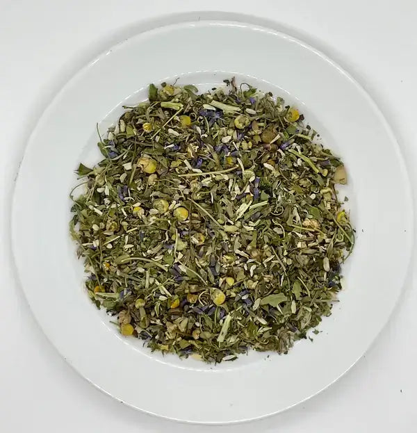 Loose leaf blend of Jaroma Night Owl Tea, featuring calming ingredients such as passionflower, lavender flowers, and skullcap leaf. This organic tea blend is perfect for promoting relaxation and aiding in a restful night’s sleep.