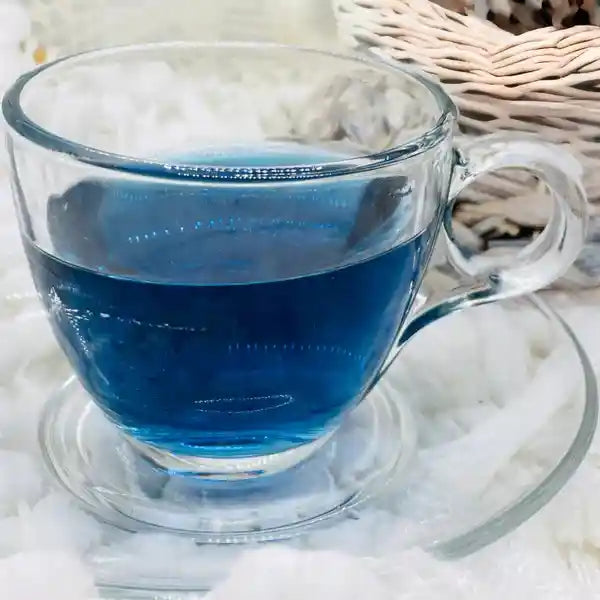 A cup of blue magic butterfly pea flower tea.