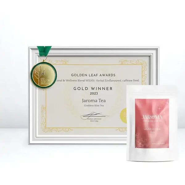 A proud moment showcasing the gold medal Jaroma Goddess Bliss Tea won at the 2023 Golden Leaf Awards. The award certificate and the winning tea package are displayed together, symbolising excellence in the Herbal & Wellness Blend category. The certificate is accompanied by a green medal and the neatly presented tea pouch.